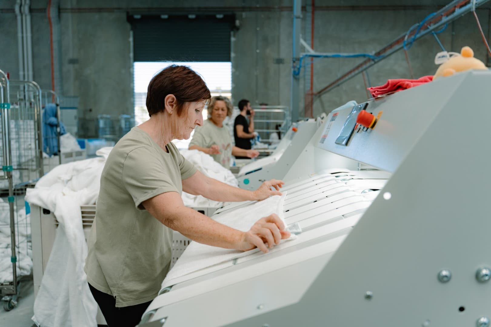 Team members working on high-quality linen processing